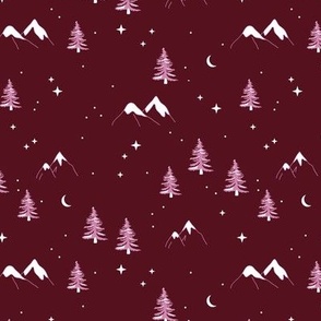 Winter wonderland mountains and pine trees wild nature landscape with snow and stars and moon vintage pink on burgundy red
