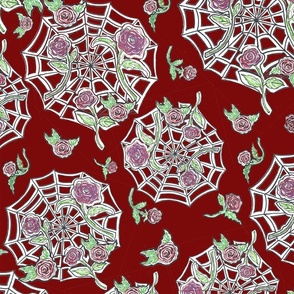 Spider web and red gothic roses on deep red background.