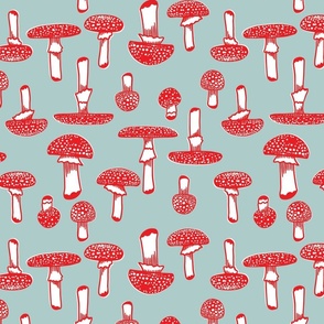 large - red mushrooms on light blue