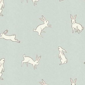Leaping white bunny rabbits on dusty blue with linen texture