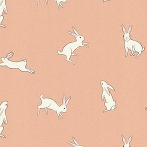 Leaping bunny rabbits on pink with linen texture