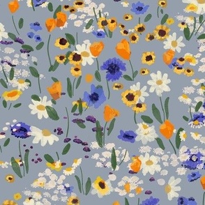 Small scale Spring flower meadow on dusty blue