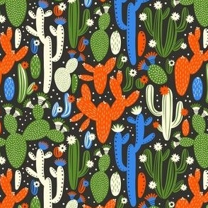 Pattern with cactus. Red, blue and white colors on black.