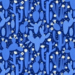 Pattern with cactus. Blue and white colors on black.