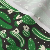 Pattern with cactus. Green and white colors on black.