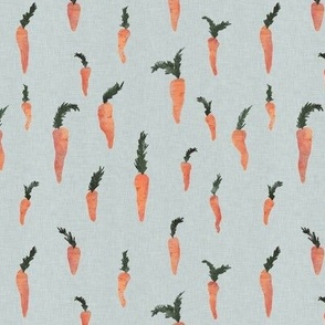 Small hand drawn watercolor carrots on dusty blue with linen texture