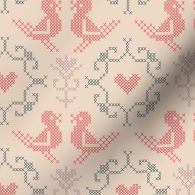 Love birds in traditional folksy cross stitch, faded red, teal and mauve on pastel apricot beige