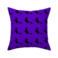 Witch silhouette purple background