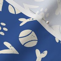 I Love Dogs Design: cream colored bones, tennis balls, hearts and paw prints on dark blue background.