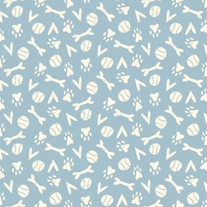I Love Dogs Design: cream colored bones, tennis balls, hearts and paw prints on light blue background.