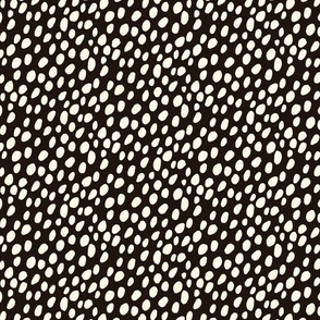 Dalmatian Spots: cream dots and spots on black background.