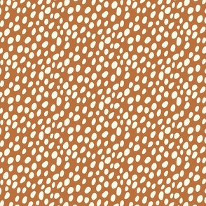 Dalmatian Spots: cream dots and spots on brown background.