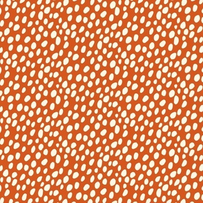 Dalmatian Spots: cream dots and spots on tomato red background.