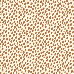 Dalmatian Spots: brown dots and spots on cream background.