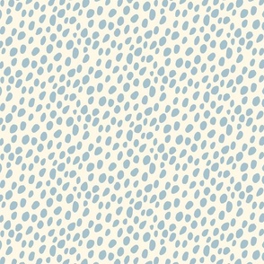 Dalmatian Spots: light blue dots and spots on cream background.