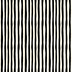 Organic Stripe Design: black imperfect vertical stripes on cream background.