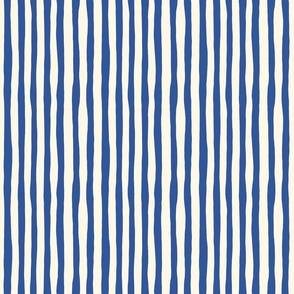 Organic Stripe Design: dark blue imperfect vertical stripes on cream background.