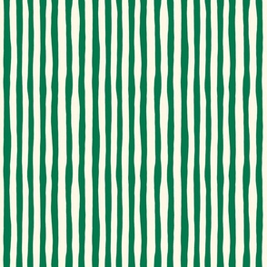 Organic Stripe Design: dark green imperfect vertical stripes on cream background.