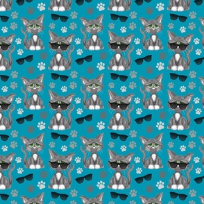 Cool cartoon cats on a dark turquoise blue background.