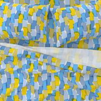 Large-scale overlapping disco confetti abstract shapes in blue, green, and yellow party fabric 