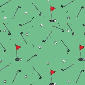 Day on the golf course - Golf clubs and cup with flag red green 