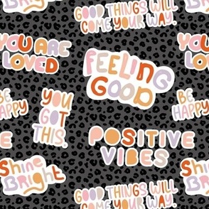 Positive vibes and happy affirmation stickers - freehand feminist quote rainbow text design to cheer you up on leopard panther spots charcoal 