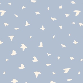 Starlings murmuration, blue sky