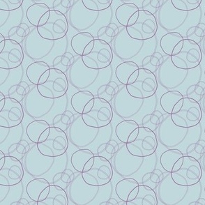 Soft Purple Circles Scattered on a Baby Blue Background