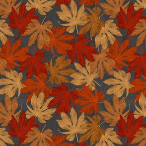 stacked autumn leaves on gray background