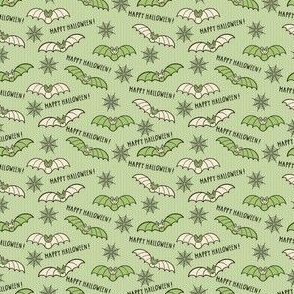 Green-beige-flying-Halloween-bats-on-a-soft-vintage-green-background-with-cobwebs-and-lines-XS-tiny