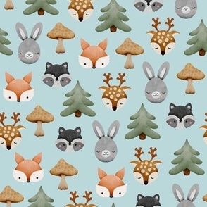 Watercolor woodland forest animals with rabbits, deers, foxes, raccoons, trees and mushrooms on light blue background 