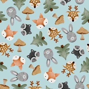 Watercolor woodland forest animals with rabbits, deers, foxes, raccoons, trees and mushrooms on light blue background
