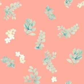 Leaves and wild flowers in salmon pink background