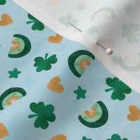 St Patrick' Day watercolor rainbows shamrock and hearts golden mint green on baby blue