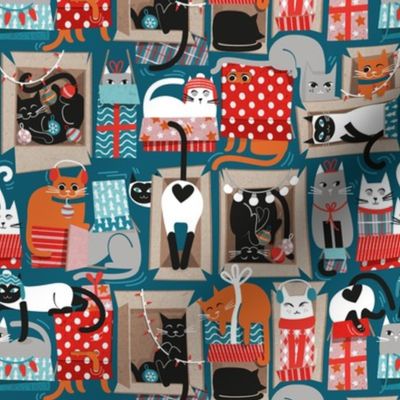 Small scale // Purfect Christmas gifts // teal background cute cats in cardboard red and teal wrapped boxes and holiday ornaments ribbons balls and lights 