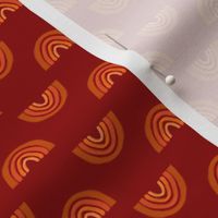 baby boy swaddle fabric orange rainbows on red background