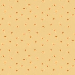 Small Scattered Seeds – tangerine orange triple spots scattered on soft apricot background