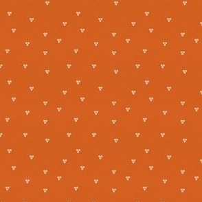 Small Scattered Seeds – apricot orange triple spots scattered on burnt orange background