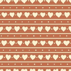 Simple stripes of cream white hearts on terracotta brown