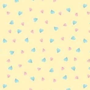 Heart confetti on a primrose yellow background