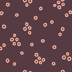 Irregular Random Pink Small Circles on Dark Brown Background