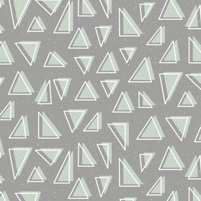 Neutral Geometric Triangle Shapes in Green on a Medium Grey Background 