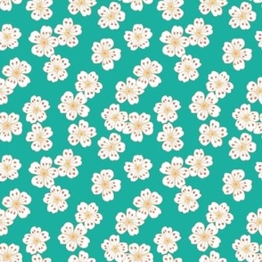 Little white blossoms on sea green