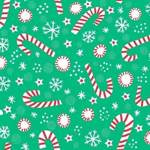 Christmas candy canes on festive green normal scale