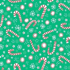 Christmas candy canes on festive green small scale