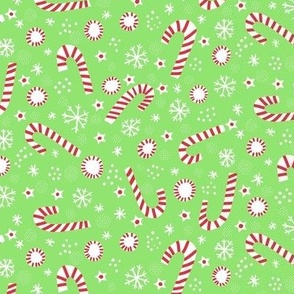 Christmas candy canes on light green small scale