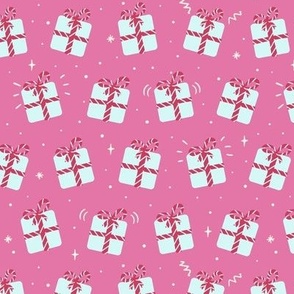 Cute blue christmas presents on pink, gift boxes with striped ribbon