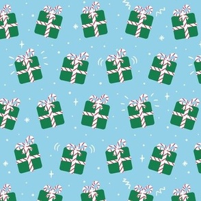 Cute green christmas presents on blue, gift boxes with striped ribbon
