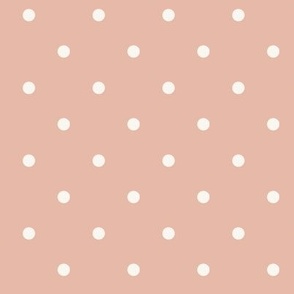 White polka dots on pale pastel tan