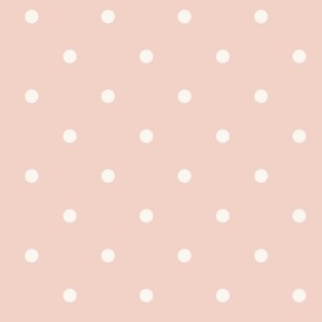 White polka dots on pale pastel blush